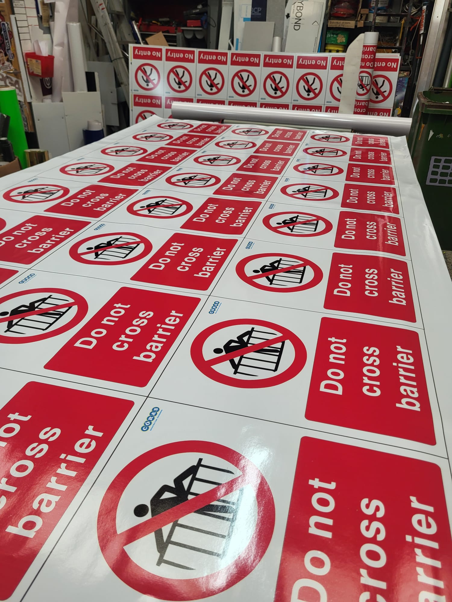 Do not cross barrier signs coming off the large format printer at South Down Signs