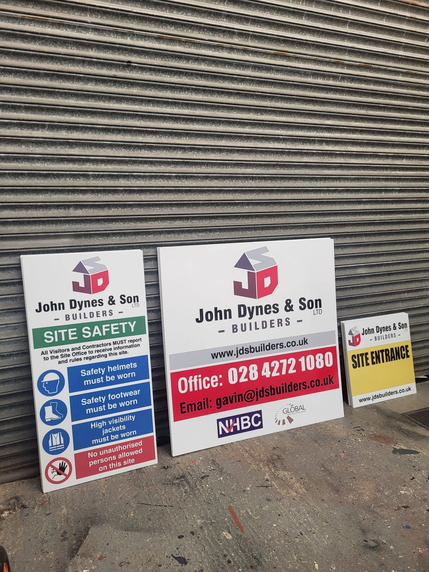 Site entrance sign and contractor board with builder branding, ready for delivery